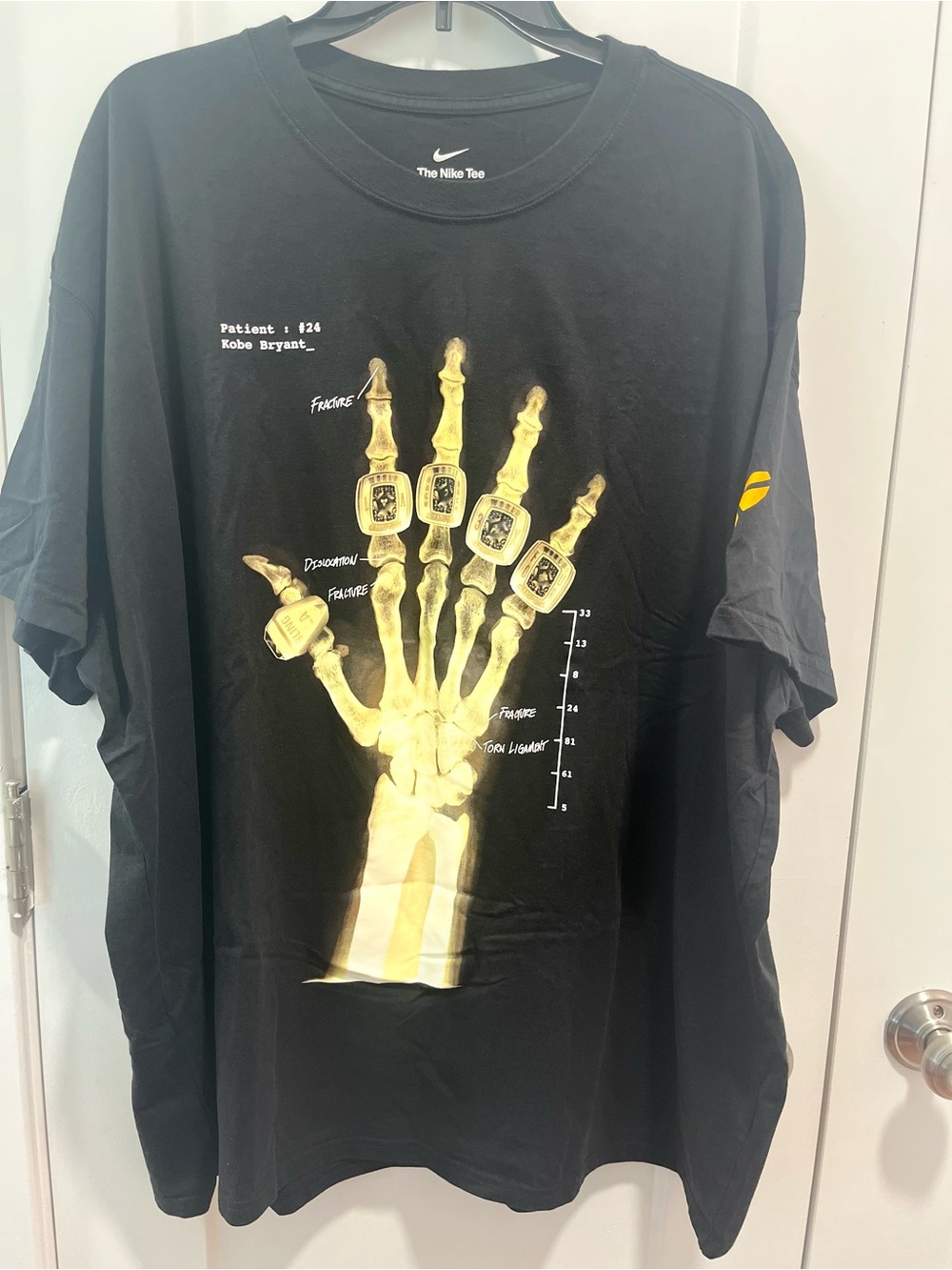 Collectors Item Nike Men’s Black T‑Shirt with Gold X‑Ray Hand Graphic